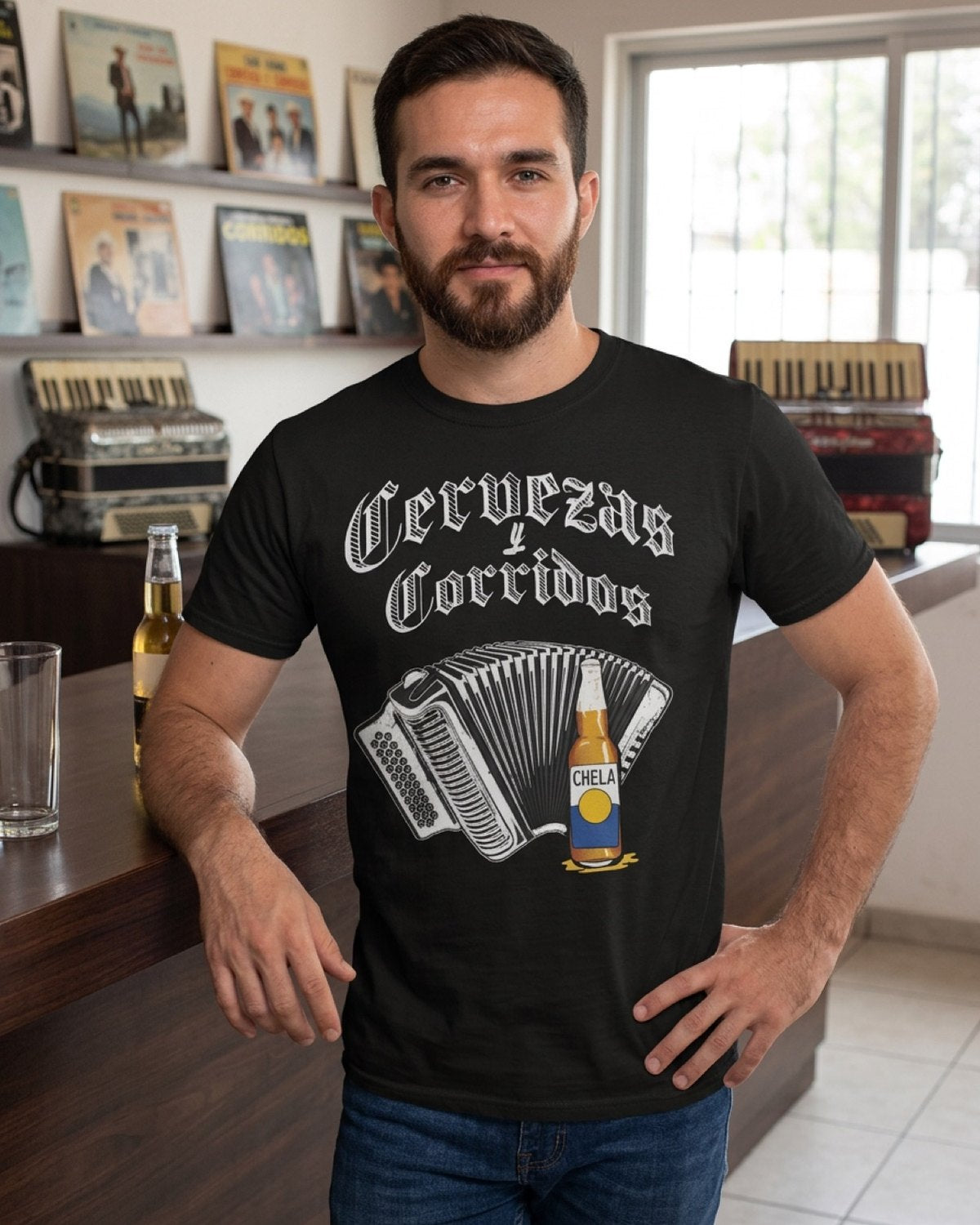 Cervezas y Corridos tee at a record-lined bar with accordions.